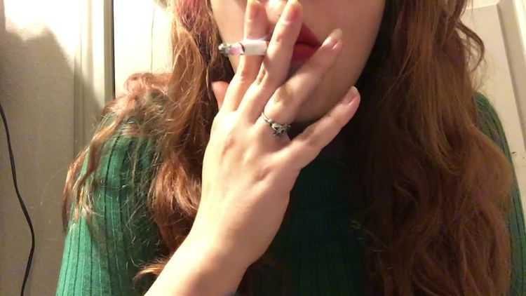 Sexy chubby teen with hot big tits in sweater smoking cork tip cigarette