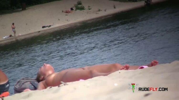 Gorgeous naturist youth gets an all over tan 6