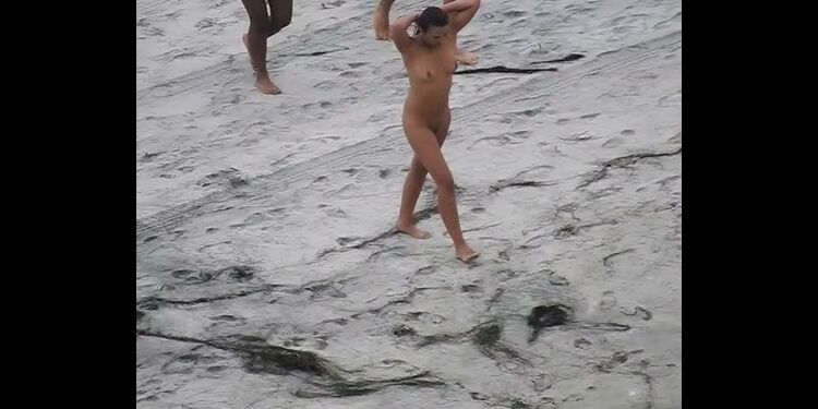 Nude beach, amateur girl shows tits and pussy