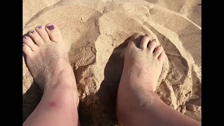 Provocative feet play in the sand