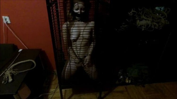 Young slave girl in cage