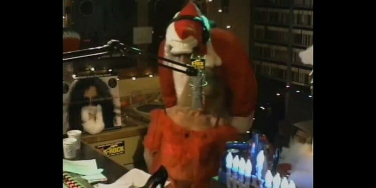 Santa tickles wn for charitable donations at a local radio station