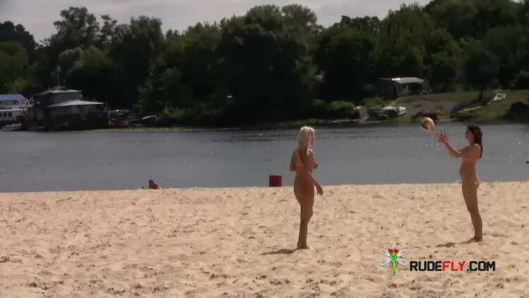 Two skinny nudist girls frolic around the beach