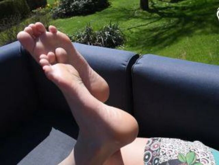 Czech Soles – Flip flops and long toes relax on public terrace