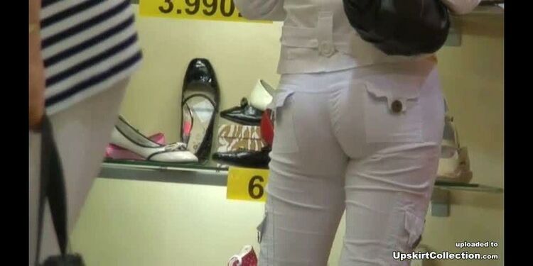 Very sexy jeans girl in a shoe shop