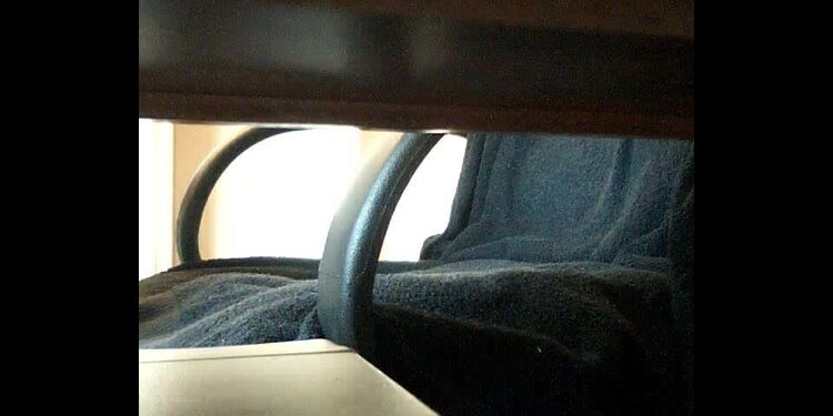 Upskirt view under her desk