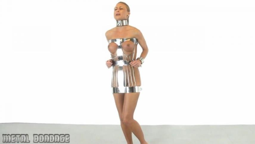 Metal Bondage – Sarah Jain posing in the Steel Hobble Dress [updated: 2024-10-11]