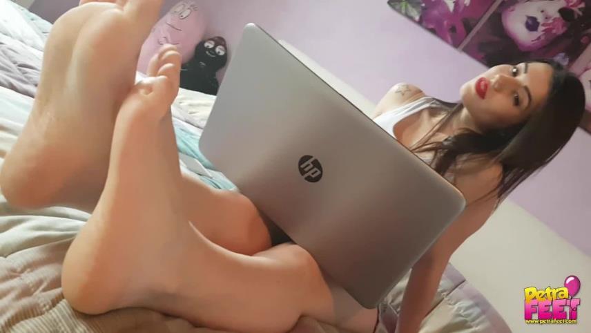 Petra Feet - Petra shows her wrinkled soles while using the pc above the bed [updated: 2024-10-24]